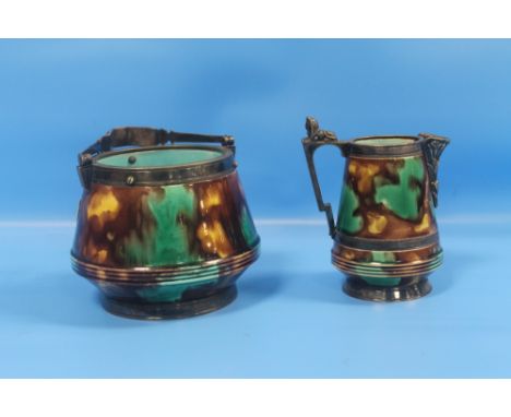 A WEDGWOOD MAJOLICA MILK/CREAM JUG TOGETHER WITH SUGAR BASIN IN THE EGYPTIAN REVIVAL STYLE WITH THOMAS HARWOOD AND SONS, BIRM