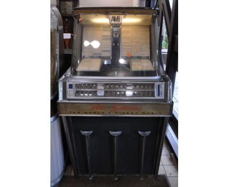 A 1960s AMI INCORPORATED MODEL K JUKEBOX JJK-200 with a vast array of 45s in mechanism, no keys but all unlocked apart from c