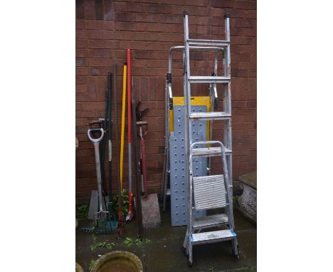 TWO ALUMINIUM STEP LADDERS, an aluminium decorators ladder, and a selection of garden hand tools (15+)
