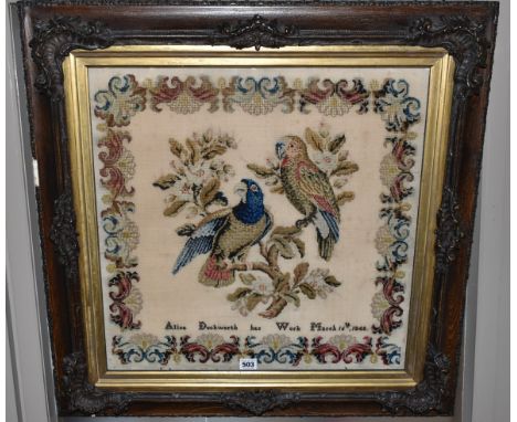 TWO 19TH CENTURY NEEDLEWORK PICTURES, the first a tapestry worked in wool depicting two exotic birds with a repeat pattern bo