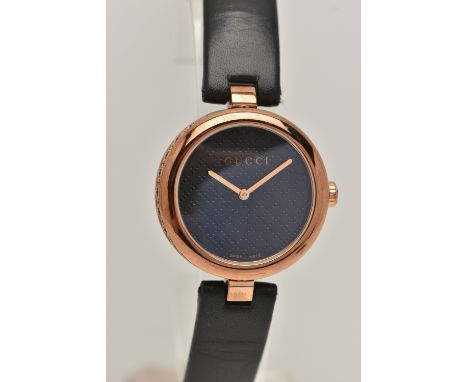 A LADIES 'GUCCI DIAMANTISSIMA' WRISTWATCH, quartz movement, round black textured dial, rose metal hands and rose coloured sta