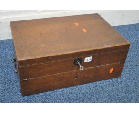 A 19TH CENTURY OAK BI-FOLD WRITING SLOPE, the first hinged compartment enclosing storage space, the second with a dark purple