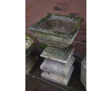 A SQUARE WEATHERED COMPOSITE GARDEN PLANTER, with a floral border, on a later separate plinth, 53cm squared x overall height 