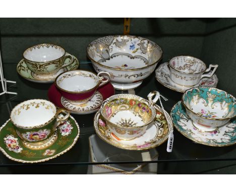 A COLLECTION OF NINETEENTH CENTURY TEA WARE, all hand painted with sprays of flowers, comprising six teacups with matching sa