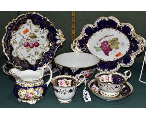 A GROUP OF VICTORIAN  PORCELAIN, all hand painted with fruits or flowers and with deep blue and gilt borders, comprising a tw
