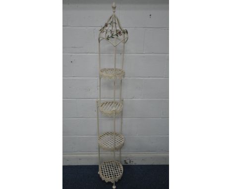 A TUBULAR METAL FOUR TIER PLANT STAND,  with floral decoration to top, each lattice shelf with wavy apron, diameter 29cm x he