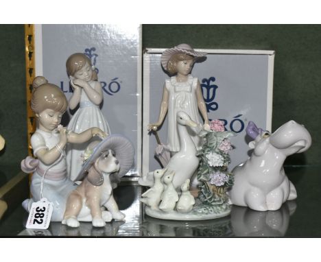 A GROUP OF LLADRO AND NAO FIGURES, comprising Lladro: An Elegant Touch no 6862, sculptor Jose Santaeulalia, issued 2002 (brim