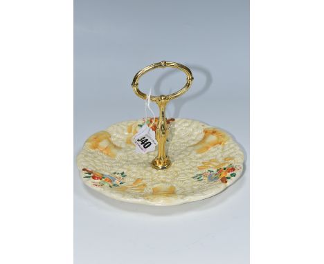 A CLARICE CLIFF 'CELTIC HARVEST' CAKE PLATE, moulded and painted with fruit and wheatsheaves on a textured ground, green prin