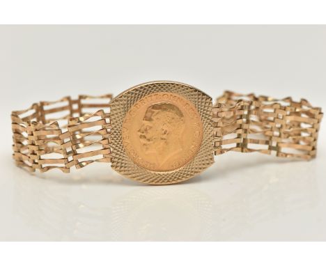 A 9CT GOLD GATE BRACELET WITH FULL SOVEREIGN, a wide six bar gate bracelet, with a full George V sovereign dated 1911, claw s