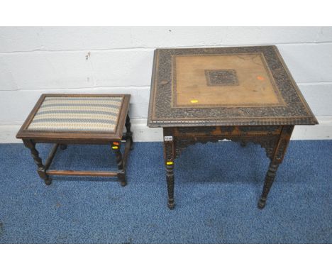 AN ANGLO INDIAN HARDWOOD CARVED OCCASIONAL TABLE, with foliate and animal carvings, shaped apron, raised on tapered legs, 61c