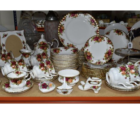 A SIXTY NINE PIECE ROYAL ALBERT 'OLD COUNTRY ROSES' DINNER SERVICE WITH SEVEN PIECES OF GIFTWARE, comprising a teapot, a crea