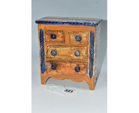 A NINETEENTH CENTURY PRATTWARE CHEST OF DRAWERS, with sponged decoration to sides and top of chest, and impressed borders sur