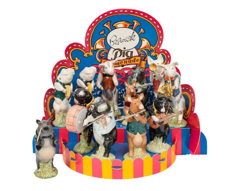 comprising eleven instrument playing pigs and a conducter, together with a card display stand