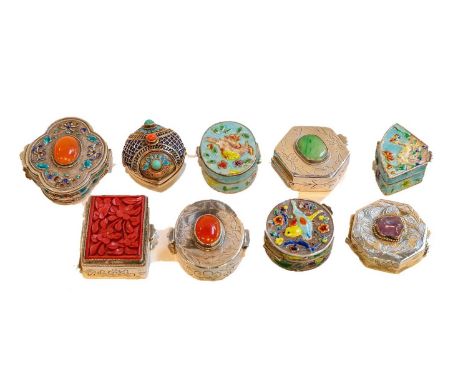 Nine 20th century silver pill boxes including an enamel example set with a carnelian cabochon, another with a cinnabar panel 