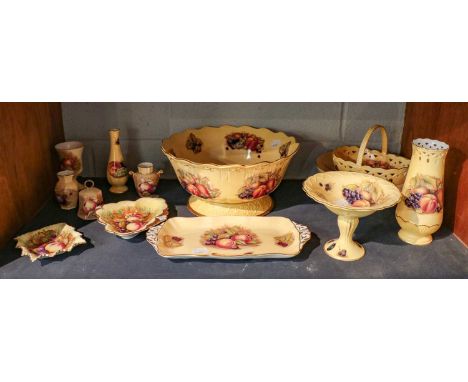 A quantity of Aynsley Orchard Gold including a large footed bowl (one shelf)