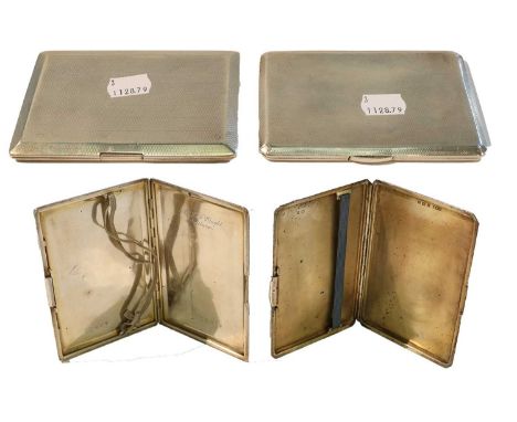 Two silver cigarette cases, each oblong and with engine turned decoration