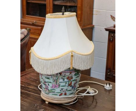 A 20th century Chinese famille rose jar and cover converted to a twin branch table lamp, together with a later Chinese table 