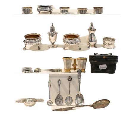 A Collection of Silver and Silver Plate, including: a silver teapot; a pair of salt-cellars; various condiment items; napkin 