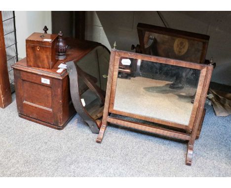 Two 19th century mahogany dressing table mirrors, a mahogany shield framed mirror, George III mahogany tea caddy, an oak case