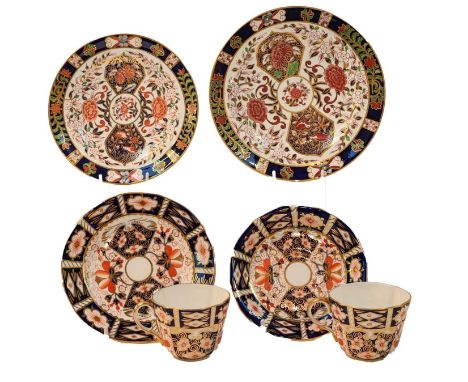 A set of six Royal Crown Derby coffee cans and saucers in the imari 2451 pattern, plus five side plates, together with twelve