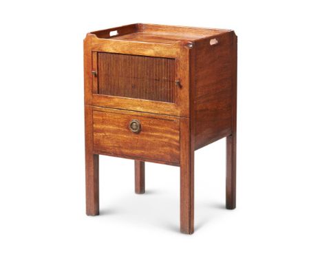 A GEORGE III MAHOGANY BEDSIDE COMMODELATE 18TH CENTURYWith a tambour door and a pull-out base revealing a lidded ceramic line