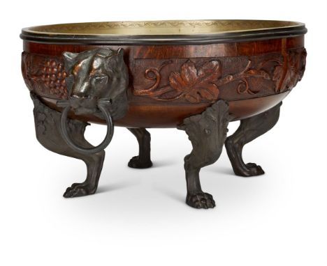 A EUROPEAN CARVED OAK AND BRONZE METAL MOUNTED JARDINIÈRELATE 19TH CENTURY, POSSIBLY DUTCH OR GERMANWith lion head mounts and