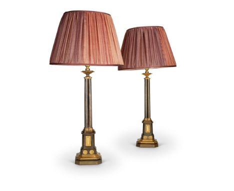 A PAIR OF PATINATED AND PARCEL-GILT 'ABBOTSFORD' OIL LAMP BASESLATE 19TH CENTURYIn Gothic Revival taste, refitted for electri