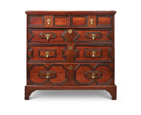 AN OAK CHEST OF DRAWERS17TH CENTURY AND LATERThe two and three long drawers with geometric mouldings, on bracket feet94cm hig