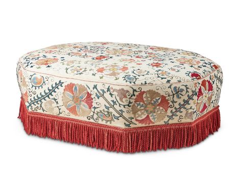 AN OCTAGONAL UPHOLSTERED CENTRE STOOLLATE 20TH CENTURYWith Suzani embroidered cover and bullion fringe43cm high, 130cm wide, 