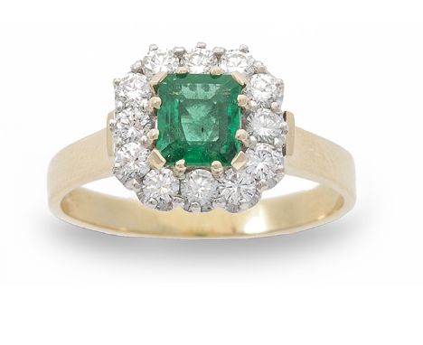 ****ESTIMATE SHOULD READ €1400-1800***A diamond and emerald ring, composed of a step-cut emerald to centre to a surround of r