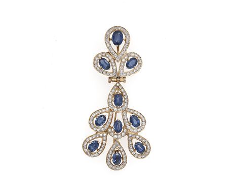 A diamond and sapphire pendant/brooch, composed of a trio of oval mixed-cut sapphires each to a diamond-set halo surround sus