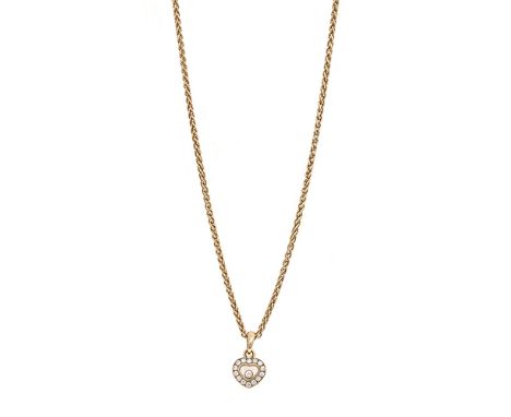A Happy Diamond pendant by Chopard, composed of a glazed heart-shaped compartment holding a single Happy Diamond to a surroun