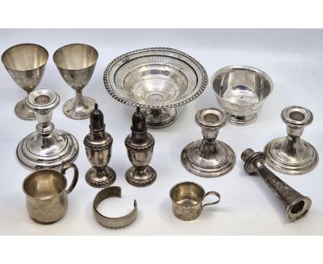 A collection of American sterling silver ware, to include: a pair of Gorham sterling silver dwarf candlesticks, with reinforc