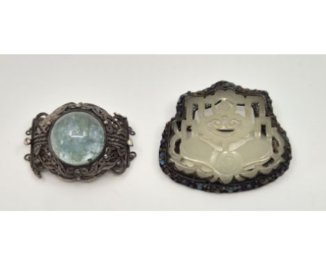 A Chinese silver, cloisonne enamel and pierced nephrite jade brooch, having central pierced nephrite jade panel carved to fro