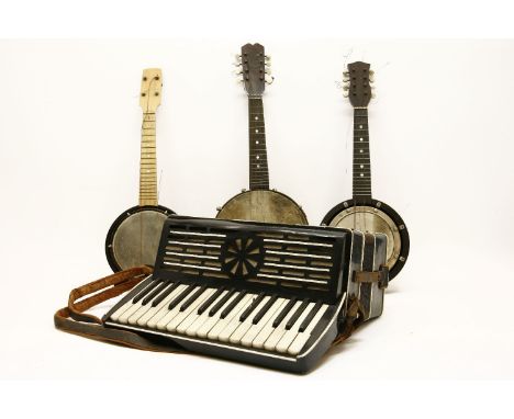 Three various banjolele, in cases, together with Lombardi piano accordion