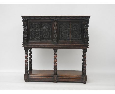 An oak cupboard on stand, with 17th century biblical panels, later mounted with cherubs playing instruments, the stand with s