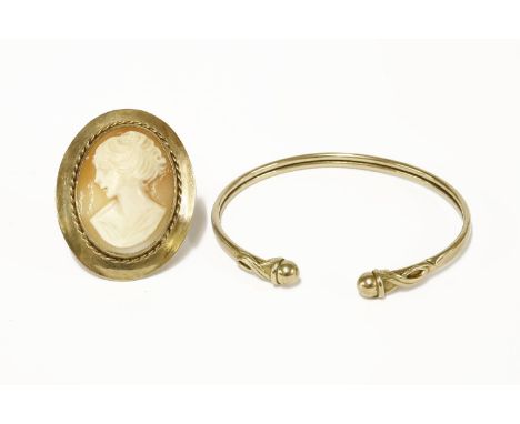 A 9ct gold torque bangle with sphere finials, and a 9ct gold shell cameo brooch/pendantbangle 5.31gcameo 8.92g