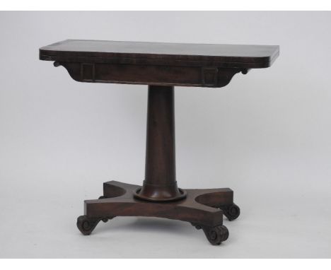 A 19th century mahogany fold over card table, on turned support, on platform base, and scroll feet, 92cm wide