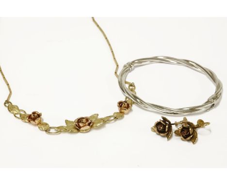 A 9ct gold necklace with two colour gold rose centrepiece, each set with a garnet,  and a pair of matching earrings and a hol