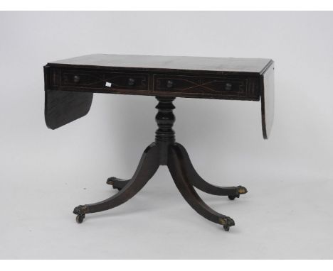 A Regency rosewood and cross banded sofa table, on turned support and quadripartite base, 97cm x 70cm x 76cm