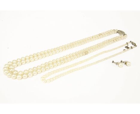A single row graduated cultured pearl necklace, with a 9ct white gold clasp, a two row simulated pearl necklace with marcasit