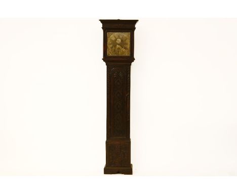 An 18th century carved oak longcase clock, the brass dial with plaque inscribed 'John Wyld, Nottingham' 210cm high