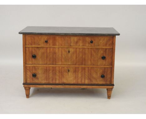 A Biedermeier satinwood commode, 19th century, with a grey marble top over two short and two long drawers, 110.5cm wide, 63cm