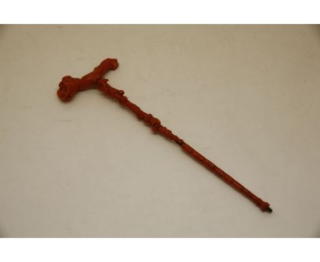 An Italian coral parasol handle, c.1900, carved with fruiting vine, 25cm