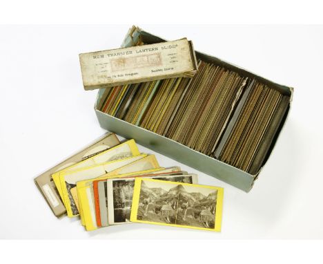 A box of approximately 150 stereoscopic cards including views, buildings, WWI, etc, and a box of strip lantern slides
