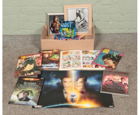 A quantity of Doctor Who ephemera, including annuals and vintage pictures of Leela, together with a boxed Corgi Dalek and Cyb