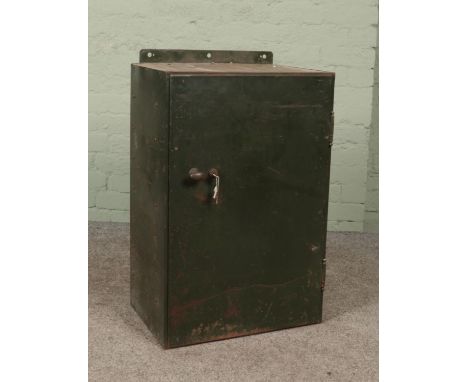 A vintage green painted steel locking cabinet.  