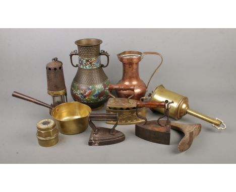 An interesting collection of metalwares including large cloisonne vase, miners lamp, Salter's clockwork spit, vintage irons, 