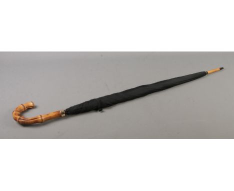 A vintage bamboo handled parasol featuring 9ct gold collar. Maker's mark for Paragon S Fox &amp; Co. Length 92cm.  Good condi