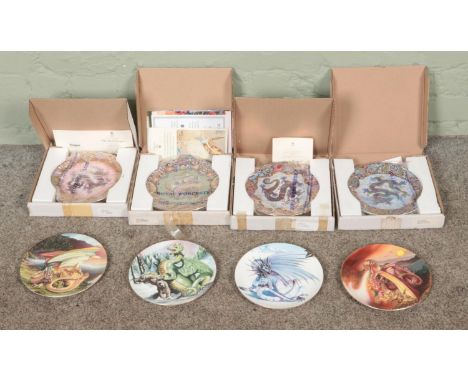 A collection of boxed dragon themed cabinet plates to include Royal Worcester Imperial Dragons and Crown Staffordshire Enchan